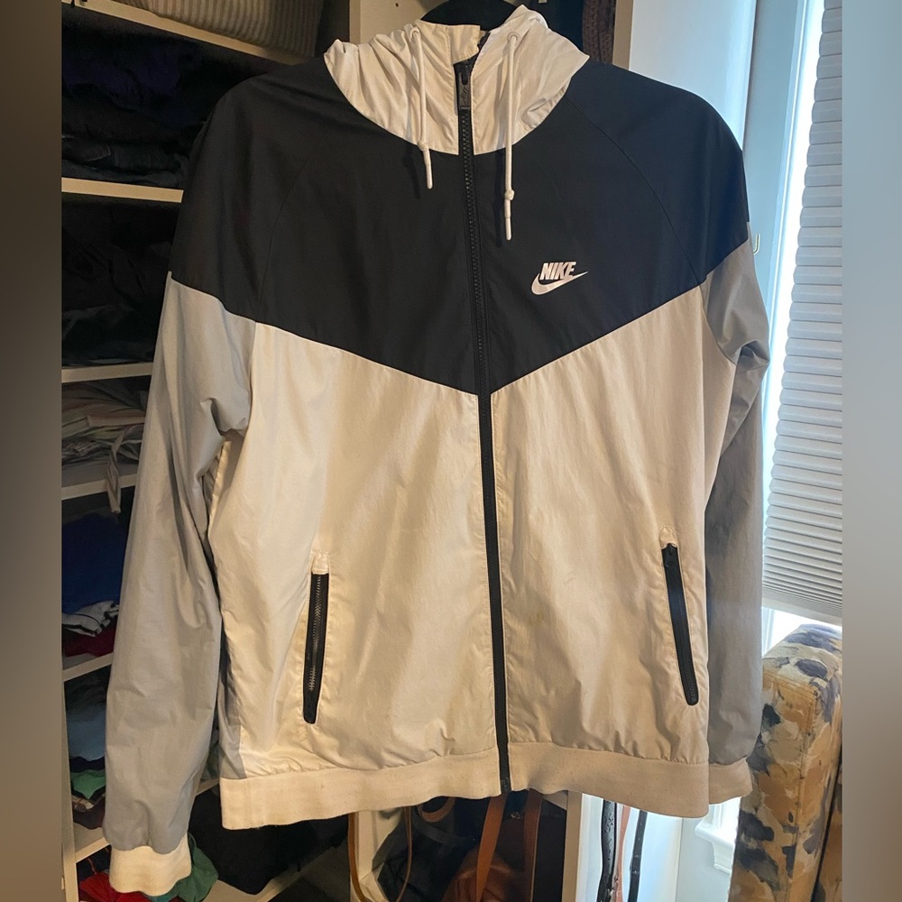 Too small for me. Nike, medium. Zip up windbreaker